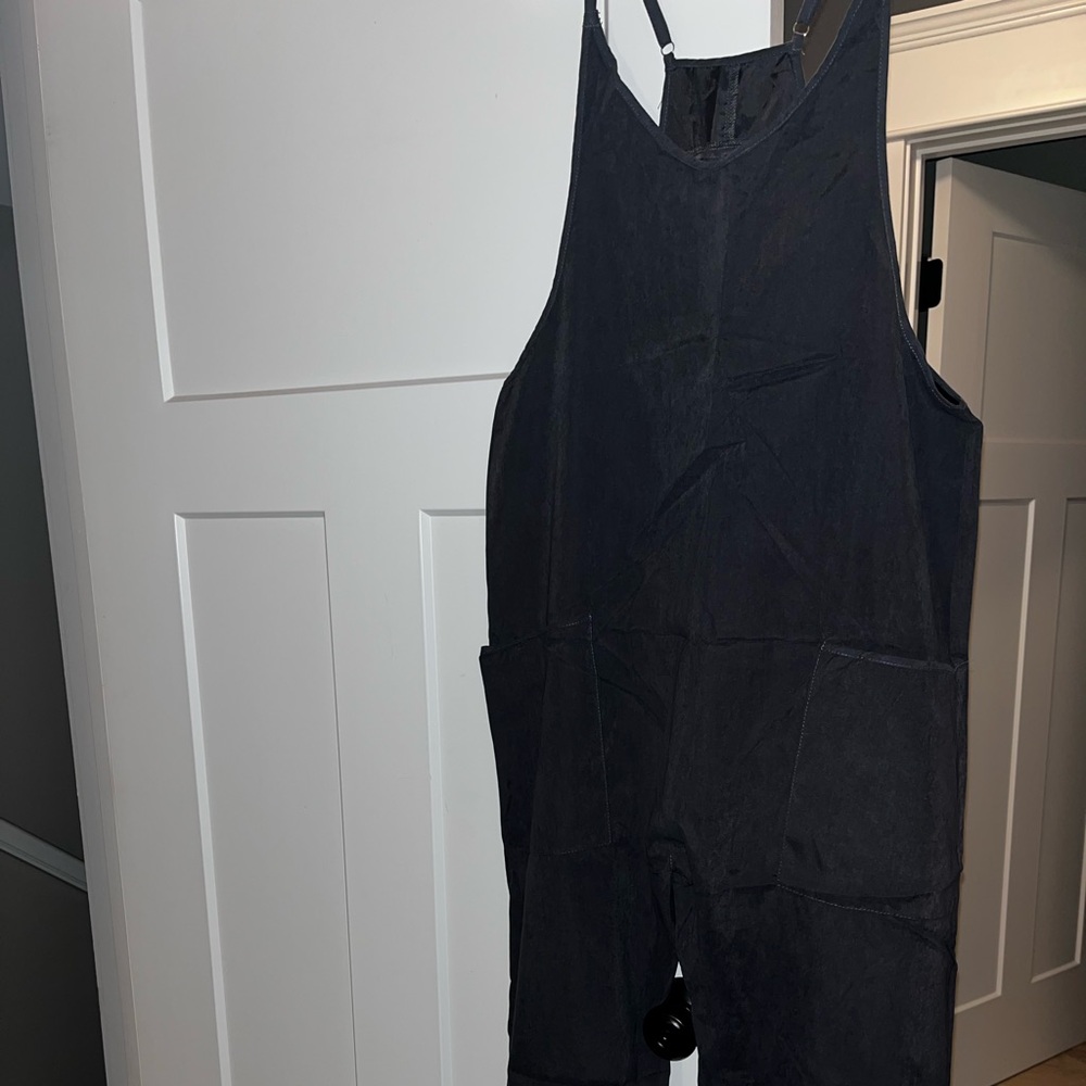 Black romper size S. Never worn